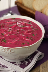 beetroot soup with shredded chicken, flaxseed and herbs