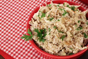 quinoa salad with shredded chicken, golden onion and herbs