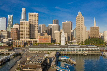 Aerial daytime view of the San Francisco skyline, near the Embarcadero area. Ferry building is...