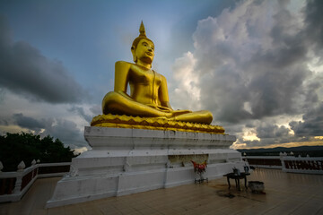 outdoor golden buddha statue in thailand
