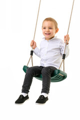 Cute Blond Boy Swinging on Rope Swing and Looking at Camera