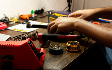 unrecognized guy working at home repairing somethings