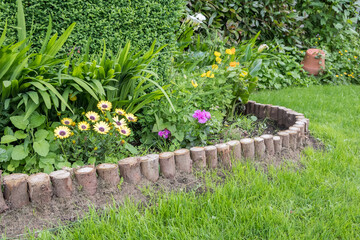 Closeup of a flower bed with a wooden border