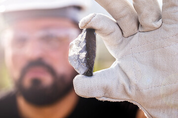 rough ore stone, palladium nugget. Concept of metal mining used in the industry. Spot focus