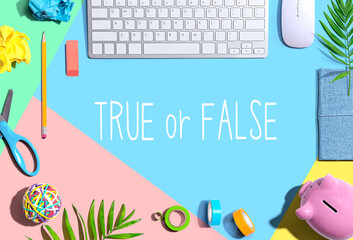 True or False with office supplies and a computer keyboard