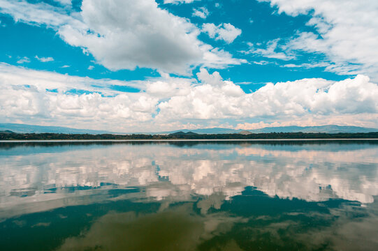 African lake and cloudy sky reflection © Lila Koan