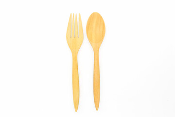 Wooden spoon and fork isolated on white background