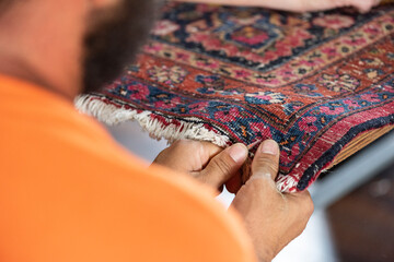 traditional hand sewing fixing old vintage antique persian carpet up close