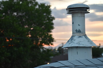 Roof Vent with a Sunset in the Background