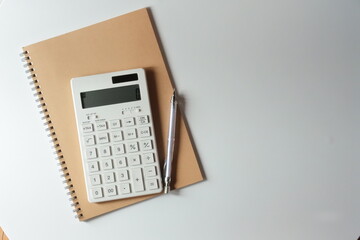 studying or household accounting or working - a calculator, a pen and a notebook