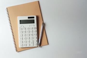 studying or household accounting or working - a calculator, a pen and a notebook