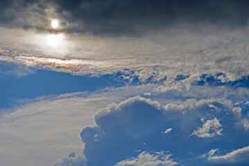 The sun comes out from behind the departing thundercloud and a beautiful sky landscape opens up