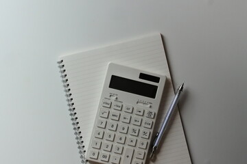 studying or household accounting or working - a calculator, a pen and a notebook