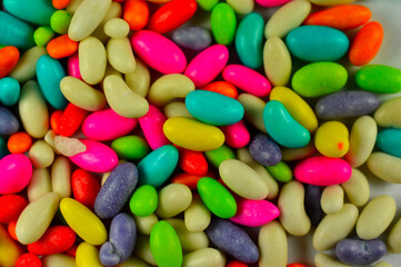 colorful sweets forming a background with some parts in focus