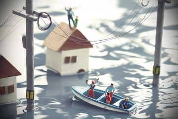 水害にあった街と救命ボートで救助活動をするジオラマの風景