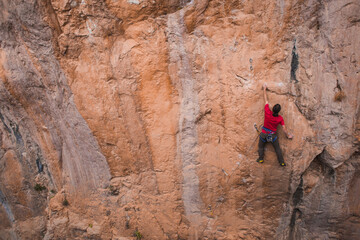 A strong man climbs a rock, Rock climbing in Turkey.
