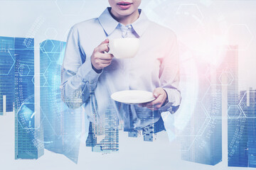 Businesswoman with coffee in smart city