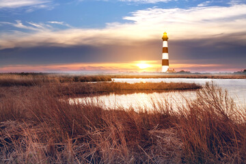 The lighthouse with marshlands in Outerbanks NC, USA. Soft blurry background. 