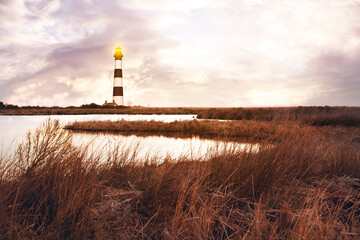 The lighthouse with marshlands in Outerbanks NC, USA. Soft blurry background. 