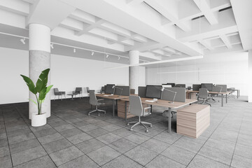 Loft open space office with wooden tables