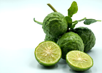 Fresh bergamot fruit with leaf and cut in half of bergamot on white background