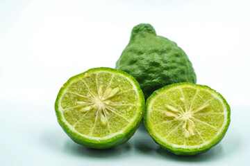 Fresh bergamot fruit with leaf and cut in half of bergamot on white background