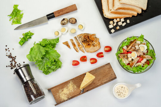 Caesar salad with chicken, anchous fish, croutons, parmesan cheese and greens. healthy food