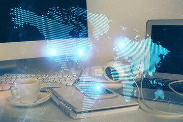 Computer on desktop with social network theme icon. Multi exposure. Concept of international connections.