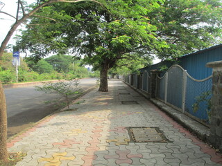 beautiful scenic view of empty road and footpath