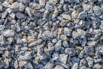 Close ups picture of stones. Wallpaper of granite stones in grey shades. Natural stones is located in the garden, as geology pattern of minerals. Macro photography.