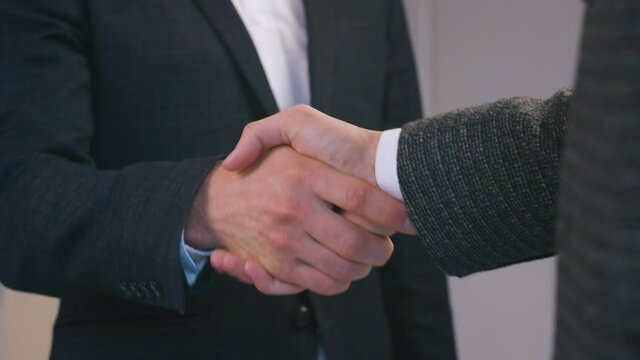 Businessmen shaking hands. Handshake of two men. Successful deal concept