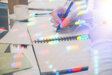 Double exposure of writing hand on background with data solution technology hologram. Ai concept.
