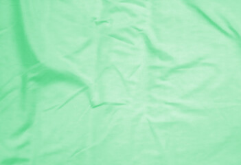 Crumpled green fabric background. abstract background.
