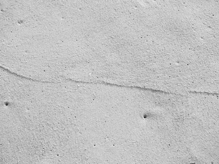 close up sand ground floor at the sea beach , background and textured, black and white color