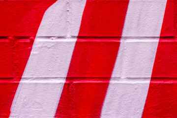 Beautiful bricks colorful street art graffiti background. Abstract gradient spray drawing fashion colors on the brick walls of the city. Urban  orange , red , white , yellow , bright texture