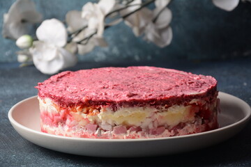 Layered salad with herring, beets, carrots, onions, potatoes and eggs. 