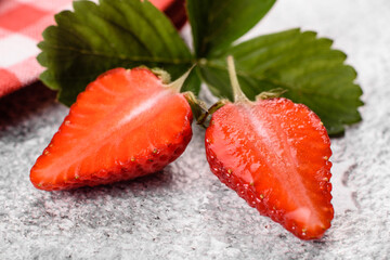 Beautiful juicy fresh strawberries on the concrete surface of the table