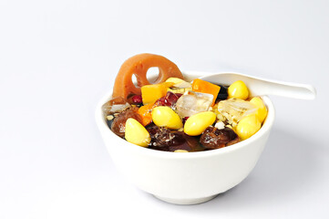 kind of Chinese dessert with spoon, white background