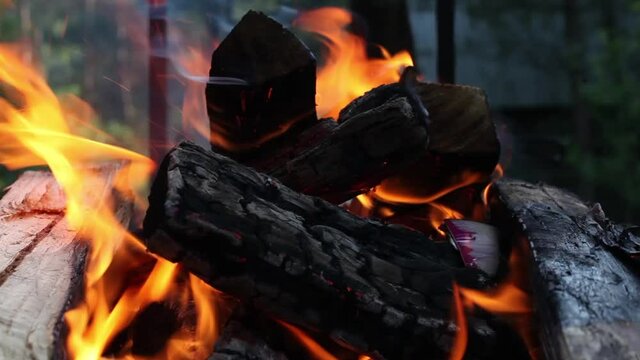 Burning woods and coals from a fire abstract background.