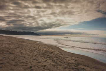 big clouds above beautiful beach on a summers day