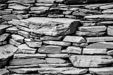 Slate stone: is a fine-grained, foliated, homogeneous metamorphic rock derived from an original shale-type sedimentary rock.