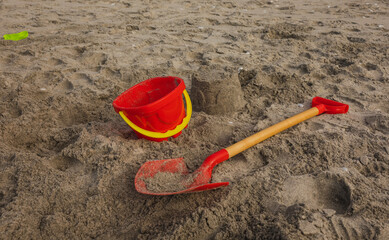 Summers Day at Beach. Kids made Sandcasle with Spade and Bucket