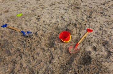 Summers Day at Beach. Kids made Sandcasle with Spade and Bucket