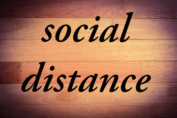 social distance in life and work place with wooden background