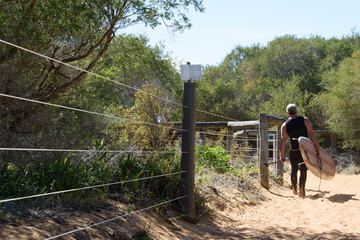 Surfer on his way to the beach