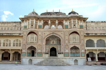 Fototapeta premium Jaipur, Rajasthan, India September 2014. gate is painted with vegetal colors. It was built in honor of the Mughal emperors. Amer Fort Ganesh Poll was built between 1611 and 1667. 