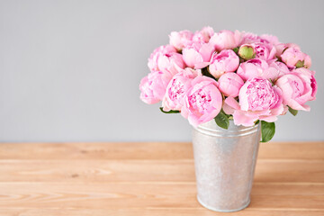 Pink Angel Cheeks peonies in a metal vase. Beautiful peony flower for catalog or online store. Floral shop concept . Beautiful fresh cut bouquet. Flowers delivery