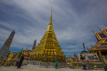 Fototapeta premium Temple of the Emerald Buddha - Wat Phra Si Rattana Satsadaram / Wat Phra Kaew-Bangkok: June 13, 2020, tourists visit to see the beauty of The Grand Palace, in Phra Nakhon District, Thailand.