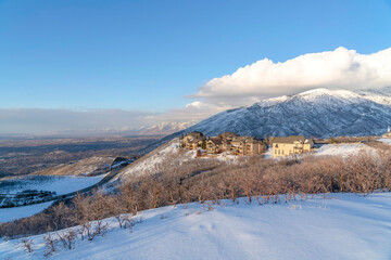 Wasatch Mountains landscape in winter with houses sitting on the snowy slope