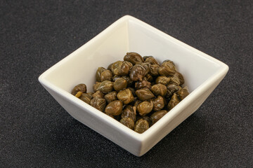 Tasty capers in the bowl